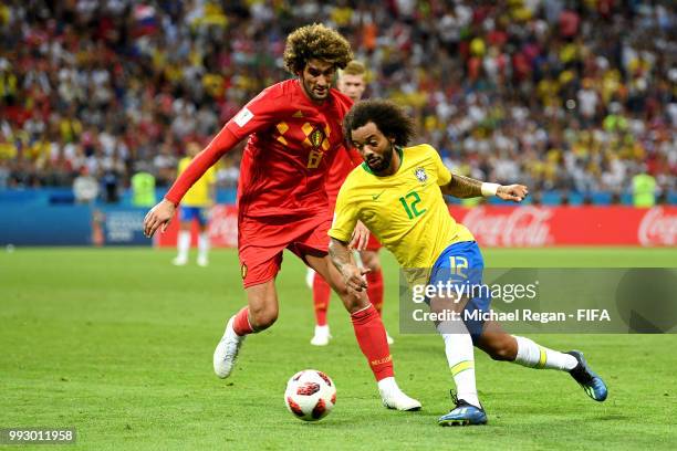 Bfra12 challenge for the ball with Marouane Fellaini of Belgium during the 2018 FIFA World Cup Russia Quarter Final match between Brazil and Belgium...