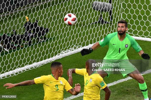 Brazil's midfielder Fernandinho looks at the ball after scoring an own-goal during the Russia 2018 World Cup quarter-final football match between...