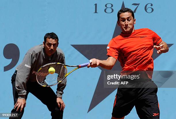 Spaniard Nicolas Almagro returns a ball to Austrian Jurgen Melzer during their Madrid Masters match on May 14, 2010 at the Caja Magic sports complex...