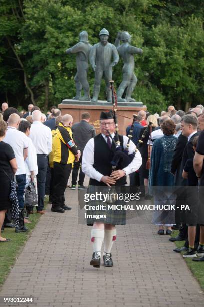Mr David Smith of the &Ocirc;Twa Pipers&Otilde; playing The Lament in Aberdeen's Hazlehead Park, where a service is to take place to remember the 167...