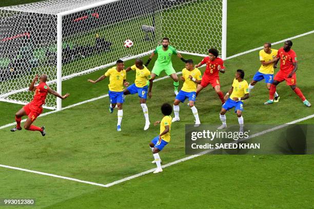 The ball shot by Belgium's defender Vincent Kompany hits Brazil's midfielder Fernandinho to score an own goal during the Russia 2018 World Cup...