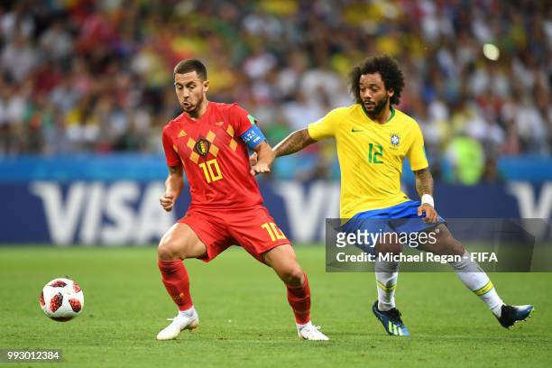 Eden Hazard of Belgium battles for possession with Marcelo of Brazil during the 2018 FIFA World Cup Russia Quarter Final match between Brazil and...