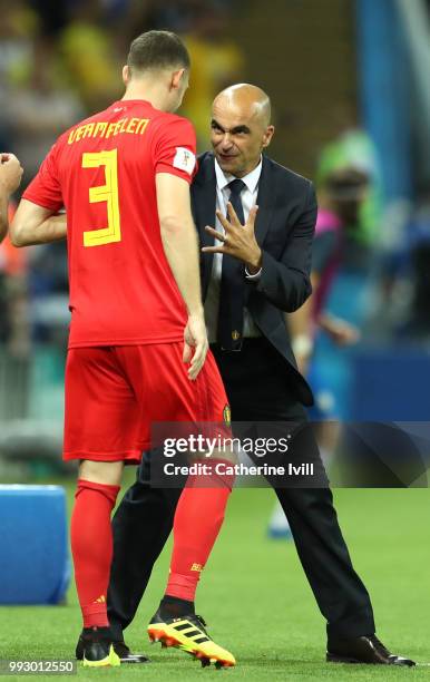 Roberto Martinez, Head coach of Belgium speaks with Thomas Vermaelen of Belgium as he prepapres to be substituted on during the 2018 FIFA World Cup...