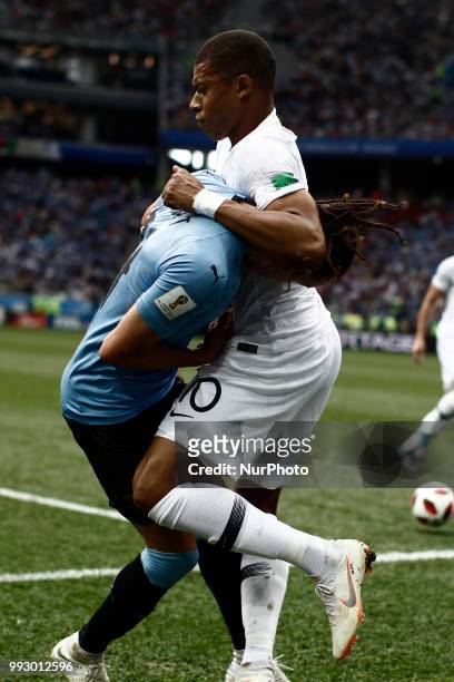 Kylian Mbappe, Diego Laxalt during 2018 FIFA World Cup Russia Quarter Final match between Uruguay and France at Nizhny Novgorod Stadium on July 6,...