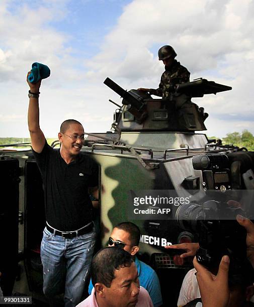Esmael Mangudadatu emerges from an armored personnel carrier as he arrives at the provincial capitol in Shariff Aguak on May 14 for his proclamation...