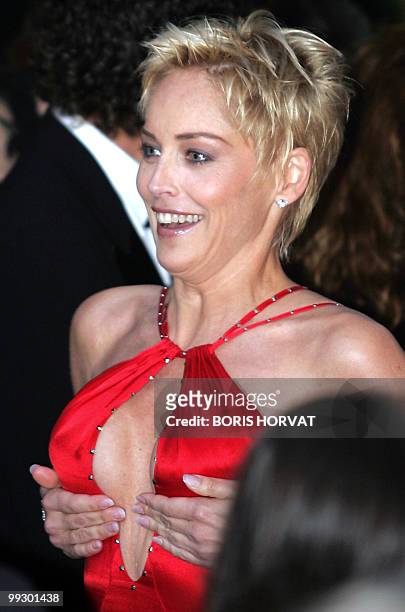 Actress Sharon Stone arrives for the American Foundation for AIDS Research "Cinema Against AIDS" benefit dinner in Cannes, 20 May 2004, on the...