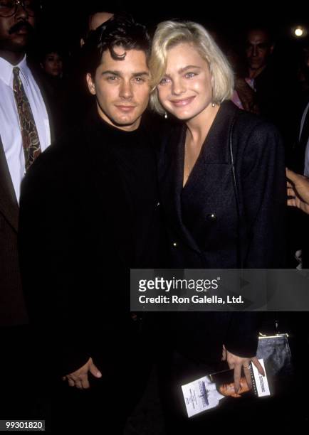 Actor Billy Warlock and actress Erika Eleniak attend the premiere of "Under Siege" on October 8, 1992 at Mann Village Theater in Westwood, California.