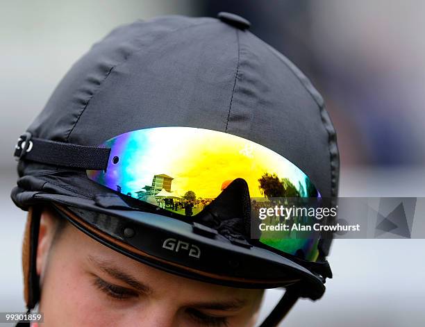 The grandstand is refelcted in the goggles of jockey Louis-Philippe Beuzelin at York racecourse on May 14, 2010 in York, England