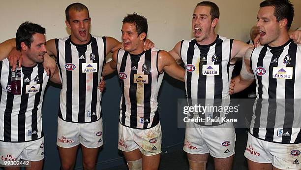 Luke Ball of the Magpies sings the club song with team mates after winning the round eight AFL match between the Fremantle Dockers and the...