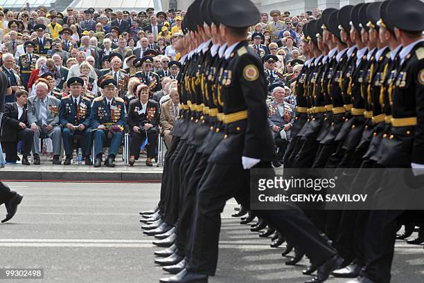 Ukrainian veterans watch a Victory Day parade in Kiev on May 9, 2010 to mark the 65th anniversary of the end of World War II. AFP PHOTO / GENYA...