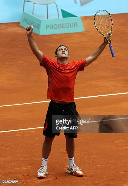 Spaniard Nicolas Almagro reacts during his Madrid Masters match against Austrian Jurgen Melzer on May 14, 2010 at the Caja Magic sports complex in...