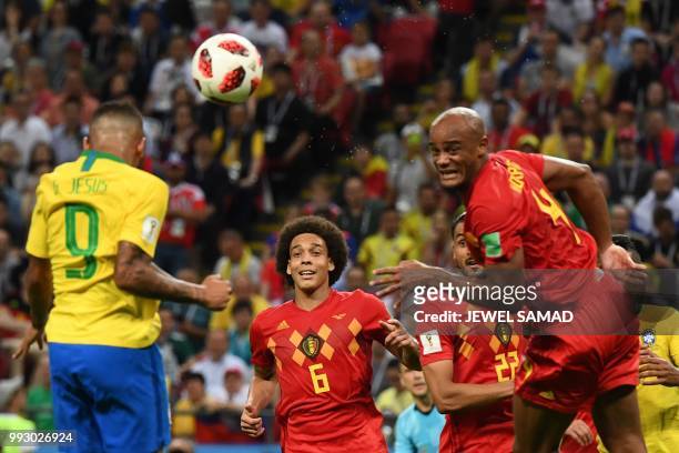 Brazil's forward Gabriel Jesus vies for the header with Belgium's defender Vincent Kompany during the Russia 2018 World Cup quarter-final football...