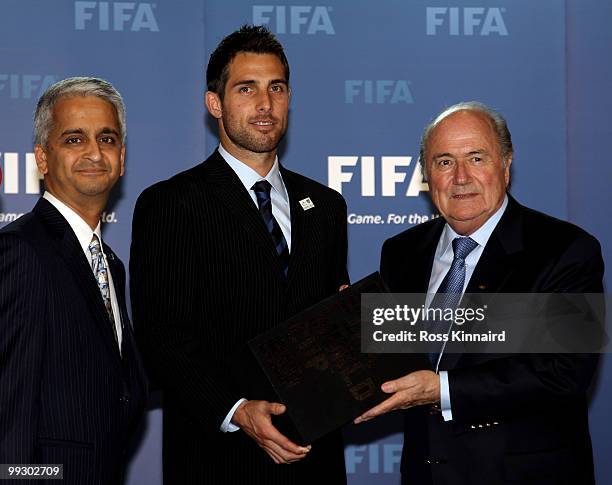 Sunil Gulati, President USSF and Chairman USA Bid Committee and Carlos Bocanerga, Captain Men�s Nation Team present Sepp Blatter, FIFA President with...