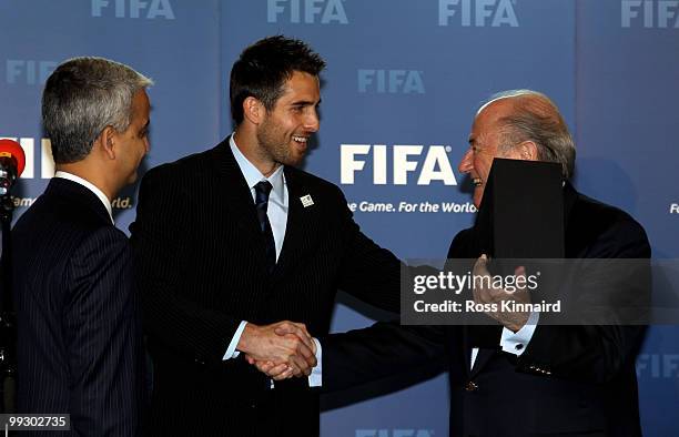 Sunil Gulati, President USSF and Chairman USA Bid Committee and Carlos Bocanerga, Captain Men�s Nation Team present Sepp Blatter, FIFA President with...