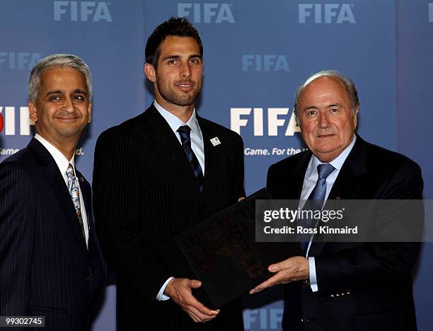 Sunil Gulati, President USSF and Chairman USA Bid Committee and Carlos Bocanerga, Captain Men�s Nation Team present Sepp Blatter, FIFA President with...