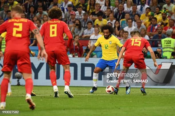 Belgium's defender Thomas Meunier marks Brazil's defender Marcelo during the Russia 2018 World Cup quarter-final football match between Brazil and...