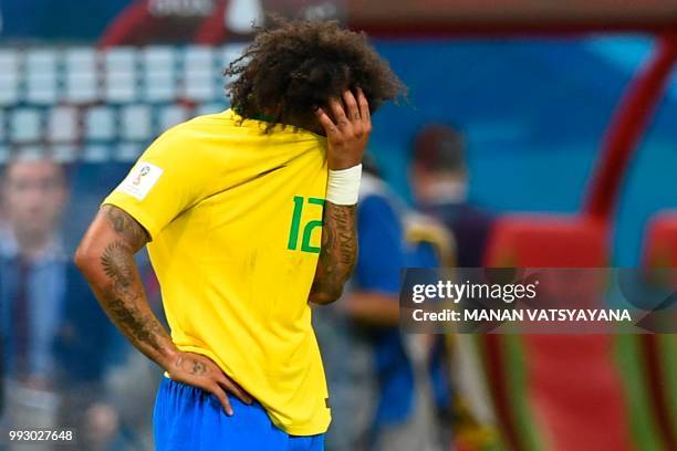 Brazil's defender Marcelo reacts to their defeat at the end of the Russia 2018 World Cup quarter-final football match between Brazil and Belgium at...