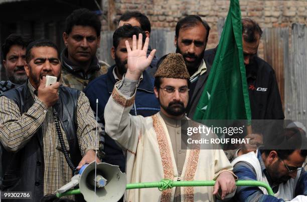 Chairman of the moderate faction of All Parties Hurriyat Conference, Mirwaiz Umar Farooq, waves to his supporters during a pro-freedom rally in...