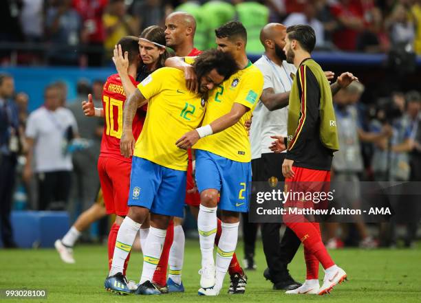 Marcelo of Brazil is consoled by Thiago Silva of Brazil at the end of the 2018 FIFA World Cup Russia Quarter Final match between Brazil and Belgium...