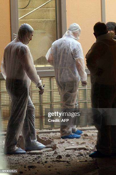 Police search for evedence in a courthouse building after a bomb explosion in the northern Greek port city of Thessaloniki on May 14, 2010. Bomb...