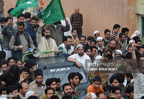 Chairman of moderate faction of All Parties Hurriyat Conference, Mirwaiz Umar Farooq, waves to his supporters during a pro-freedom rally in Srinagar...