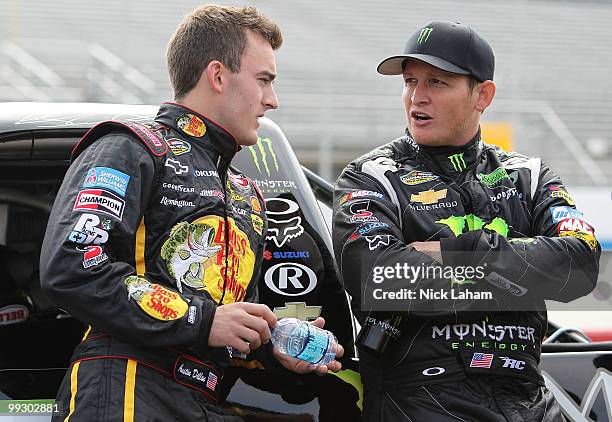 Austin Dillon , driver of the Bass Pro Shops/Trackers Chevrolet, talks with Ricky Carmichael, driver of the Monster Energy Chevrolet, on the grid...