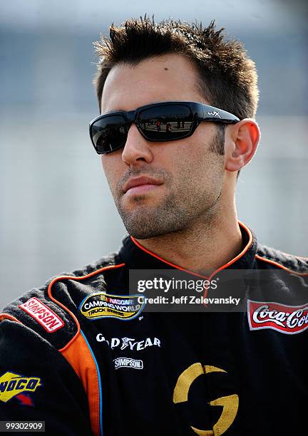 Aric Almirola, driver of the Graceway Pharm/AKawareness.com Toyota, stands on the grid during qualifying for the NASCAR Camping World Truck Series...