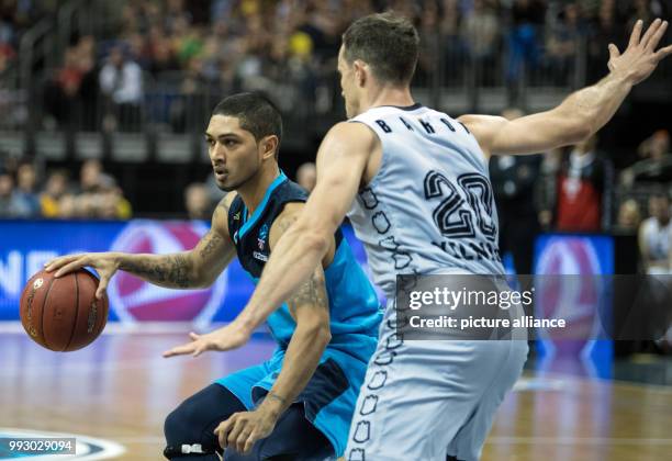 Alba's Peyton Siva and Jimmy Baron of Vilnius vie for the ball during the Eurocup basketball match between ALBA Berlin and Lietuvos Rytas Vilnius in...