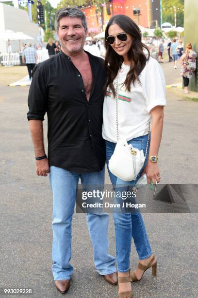 Simon Cowell and Lauren Silverman pose backstage as Barclaycard present British Summer Time Hyde Park at Hyde Park on July 6, 2018 in London, England.