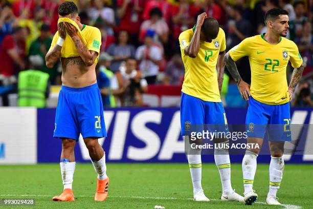 Brazil's forward Roberto Firmino, Brazil's midfielder Fernandinho and Brazil's defender Fagner react after losing the Russia 2018 World Cup...