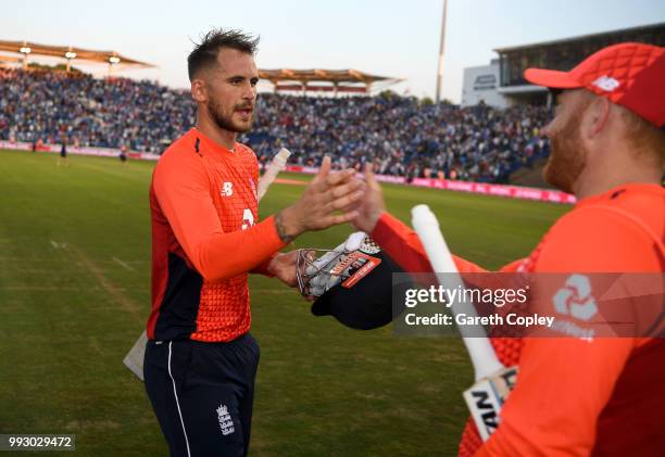 Alex Hales of England celebrates with Jonathan Bairstow after winning the 2nd Vitality International T20 match between England and India at SWALEC...