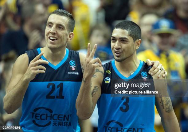 Alba's Spencer Butterfield and Peyton Siva celebrating victory after the Eurocup basketball match between ALBA Berlin and Lietuvos Rytas Vilnius in...