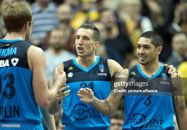 Alba's Luke Sikma , Spencer Butterfield and Peyton Siva celebrating victory after the Eurocup basketball match between ALBA Berlin and Lietuvos Rytas...