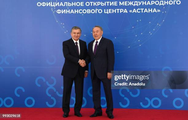 President of Kazakhstan, Nursultan Nazarbayev shakes hands with President of Uzbekistan Shavkat Mirziyoyev before attending an event within the...