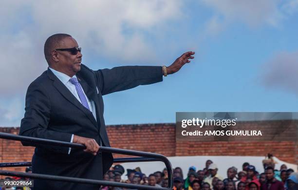 Malawi President Arthur Peter Mutharika waves to the crowd as he arrives to the national celebrations at Mzuzu Stadium to commemorate the country's...