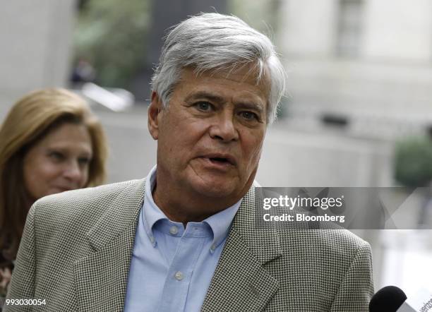 Former State Senate Majority Leader Dean Skelos speaks to a member of the media while exiting federal court in New York, U.S., on Friday, July 6,...