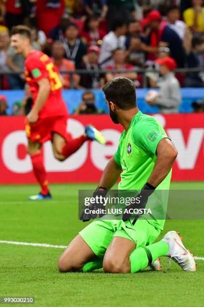 Brazil's goalkeeper Alisson reacts after taking a second goal during the Russia 2018 World Cup quarter-final football match between Brazil and...