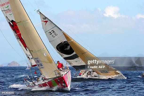 The "Groupe Bel" and "MemoiresStBarth.com" monohulls are seen upon their arrival at the end of the transat AG2R La Mondiale sailing race between...