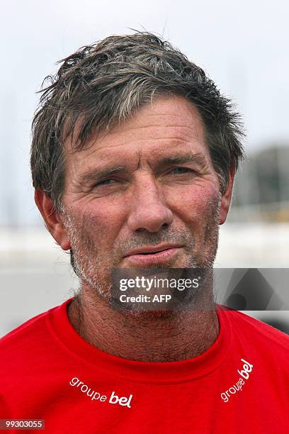 French skipper Kito de Pavant poses on his "Groupe Bel" monohull upon his arrival at the end of the transat AG2R La Mondiale sailing race between...