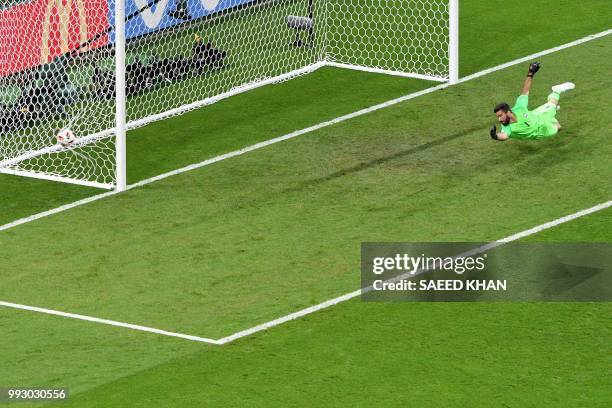 Brazil's goalkeeper Alisson concedes the second goal during the Russia 2018 World Cup quarter-final football match between Brazil and Belgium at the...