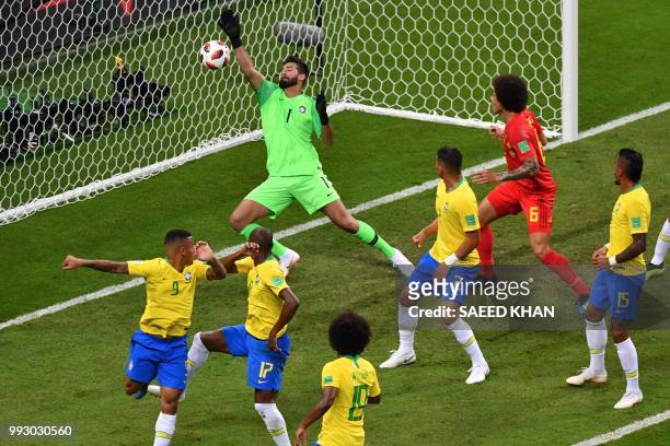 Brazil's goalkeeper Alisson fails to stop an own-goal by Brazil's midfielder Fernandinho during the Russia 2018 World Cup quarter-final football...