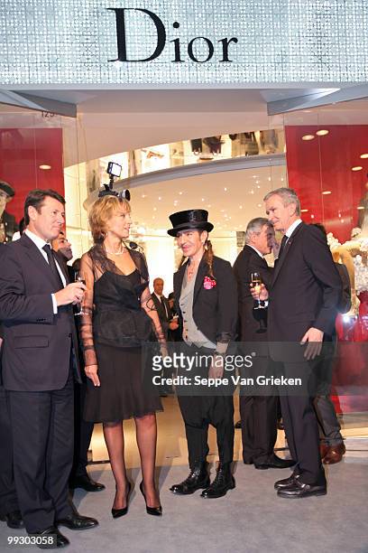 Dior designer John Galliano, LVMH chairman Bernard Arnault and Helene Arnault bring a toast to the opening of the new Dior shop in Shanghai on May...
