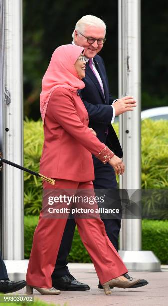 German President Frank-Walter Steinmeier being received with military honours by the President of Singapore, Halimah Jacob, in front of the Istana...