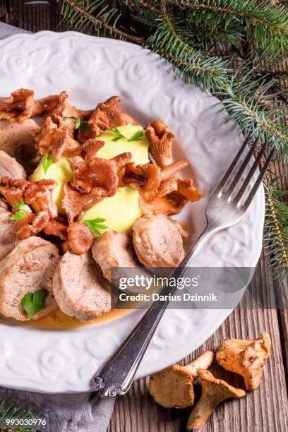 mashed potatoes with pork medallions and chanterelle sauce - mashed stock pictures, royalty-free photos & images