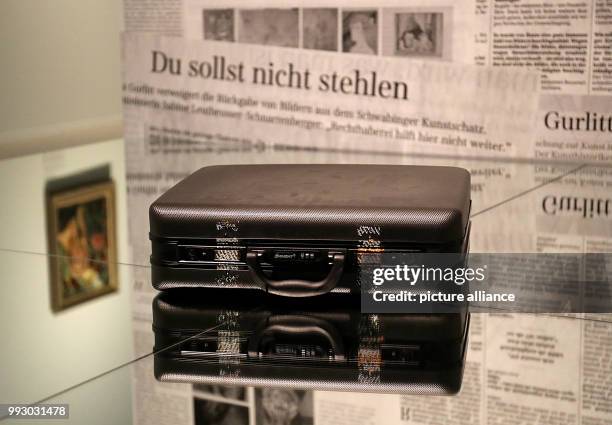 Cornelius Gurlitt's suitcase lying on a mirror in front of newspaper clippings in Bonn, Germany, 02 November 2017. The exhibition "Inventory Gurlitt"...