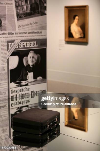 Cornelius Gurlitt's suitcase lying on a mirror in front of newspaper clippings in Bonn, Germany, 02 November 2017. The exhibition "Inventory Gurlitt"...