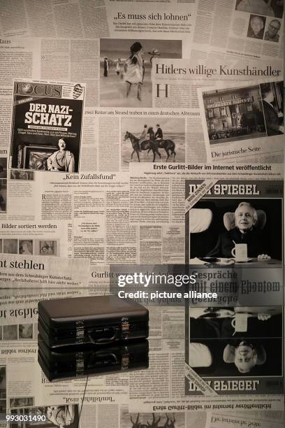 Cornelius Gurlitt's suitcase lying on a mirror in front of newspaper clippings in Bonn, Germany, 02 November 2017. The exhibition "Inventory Gurlitt"...