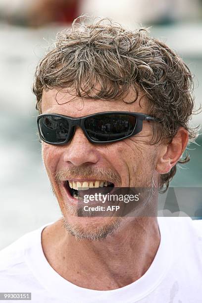 French skipper Christophe Lebas laughs on his "MemoireStBarth.com" monohull upon his arrival at the end of the transat AG2R La Mondiale sailing race...
