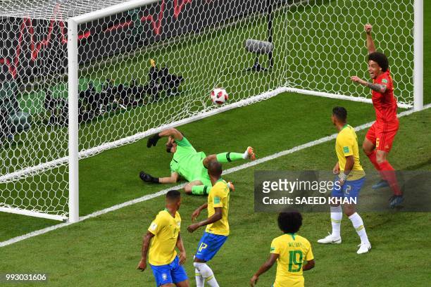 Brazil's midfielder Fernandinho looks at the ball after scoring an own-goal during the Russia 2018 World Cup quarter-final football match between...