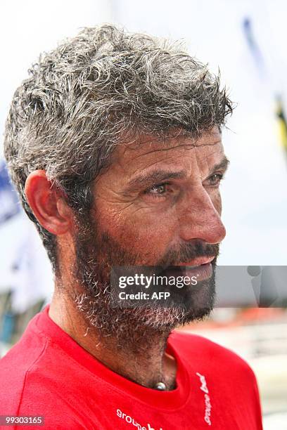 French skipper Sébastien Audigane poses on his "Groupe Bel" monohull upon his arrival at the end of the transat AG2R La Mondiale sailing race between...